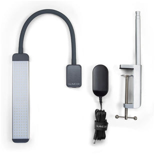 A Glamcor Mono Light Kit for tattoo artists with charger, clamp & light.