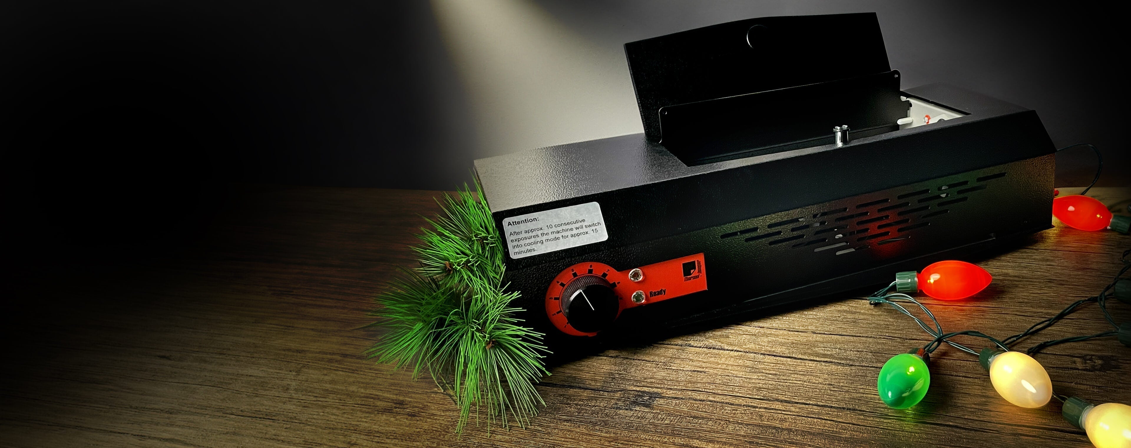 Thermal Imager on a table with holiday lights